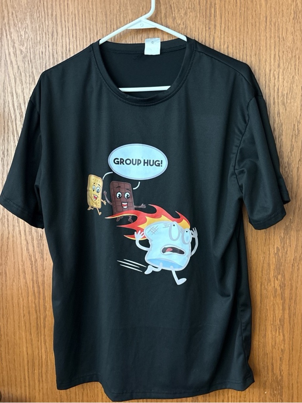 Black Graphic Tee with 'Group Hug!' Cartoon Design